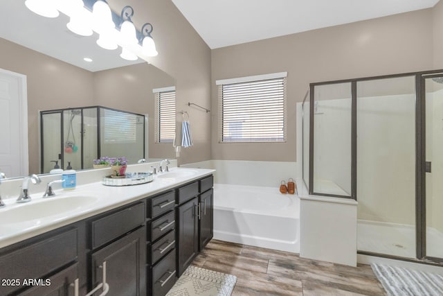 2605 W Desert Marigold Dr, Phoenix, AZ 85085 - full bathroom with a sink, a shower stall, wood finished floors, and a garden tub