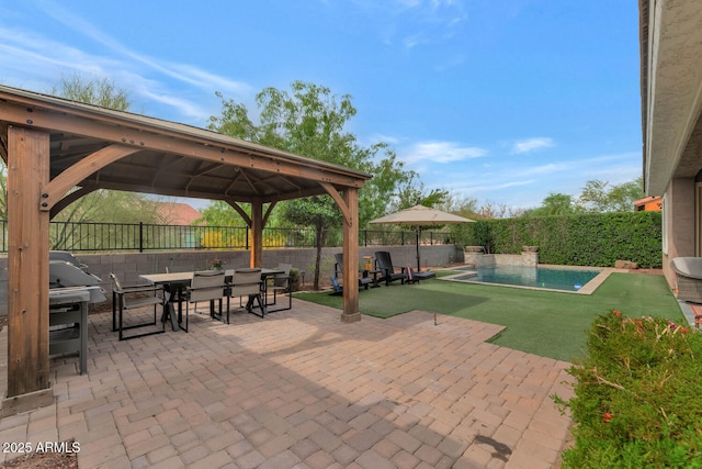 2605 W Desert Marigold Dr, Phoenix, AZ 85085 - view of patio featuring area for grilling, a fenced backyard, a gazebo, a fenced in pool, and outdoor dining area