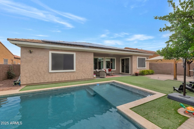 2605 W Desert Marigold Dr, Phoenix, AZ 85085 - rear view of property featuring a patio area, a fenced backyard, roof mounted solar panels, and stucco siding