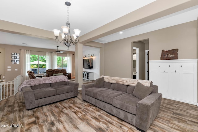 2605 W Desert Marigold Dr, Phoenix, AZ 85085 - living room featuring recessed lighting, a notable chandelier, and wood finished floors