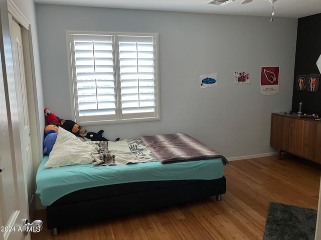 bedroom featuring ceiling fan and hardwood / wood-style floors