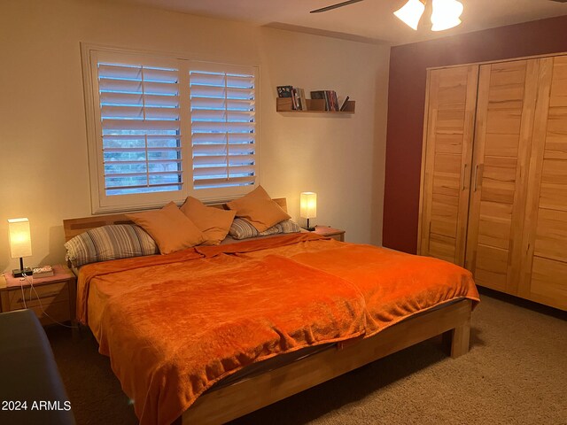 carpeted bedroom with ceiling fan