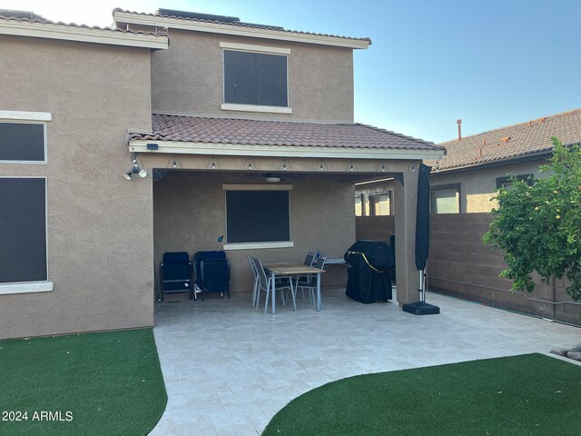 rear view of property featuring a patio