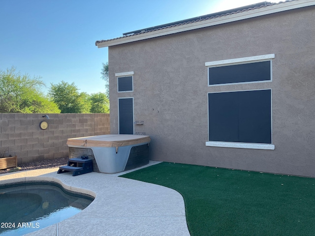 exterior space featuring a fenced in pool