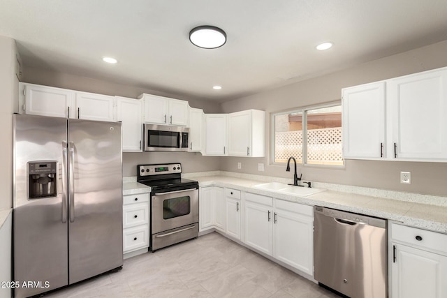 619 E Jensen St Unit 14, Mesa, AZ 85203 - kitchen featuring stainless steel appliances, white cabinetry, and recessed lighting