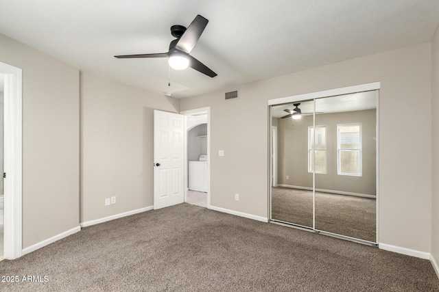 619 E Jensen St Unit 14, Mesa, AZ 85203 - unfurnished bedroom featuring washer / dryer, carpet flooring, a closet, ceiling fan, and arched walkways