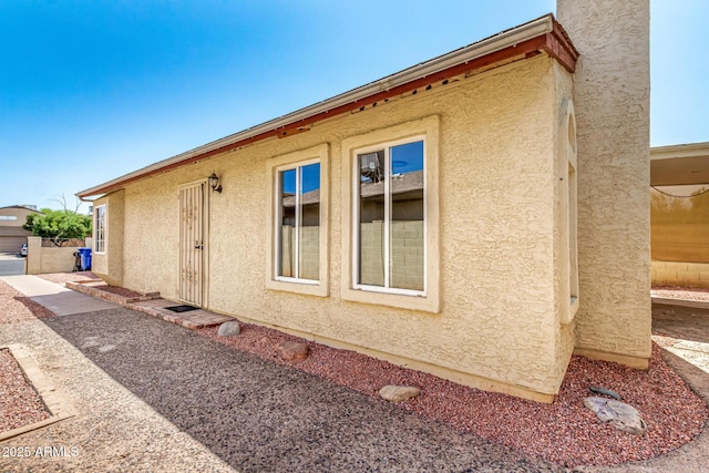 619 E Jensen St Unit 14, Mesa, AZ 85203 - view of side of home featuring stucco siding