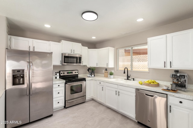 619 E Jensen St Unit 14, Mesa, AZ 85203 - kitchen featuring stainless steel appliances, white cabinetry, light countertops, and recessed lighting