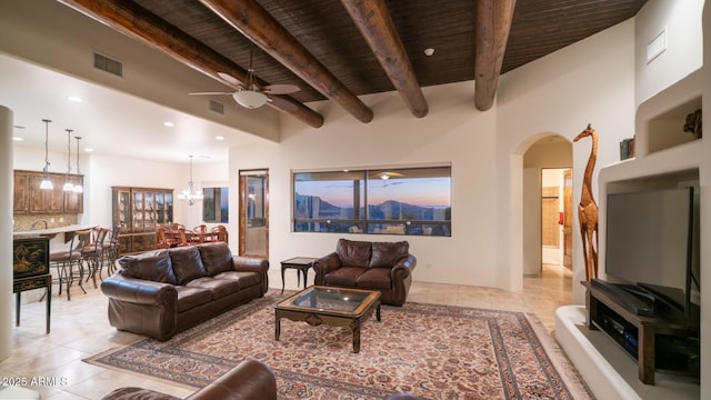 3168 S Yaqui Ln, Gold Canyon, AZ 85118 - tiled living room featuring wood ceiling, beam ceiling, and ceiling fan