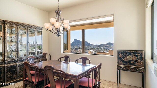 3168 S Yaqui Ln, Gold Canyon, AZ 85118 - dining area featuring a healthy amount of sunlight, a mountain view, and a notable chandelier