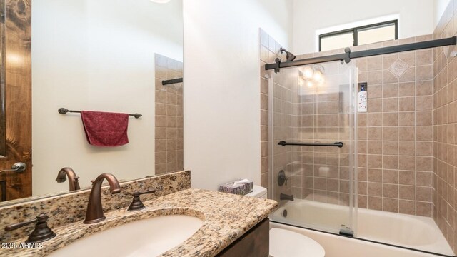 3168 S Yaqui Ln, Gold Canyon, AZ 85118 - full bathroom featuring vanity, toilet, and combined bath / shower with glass door