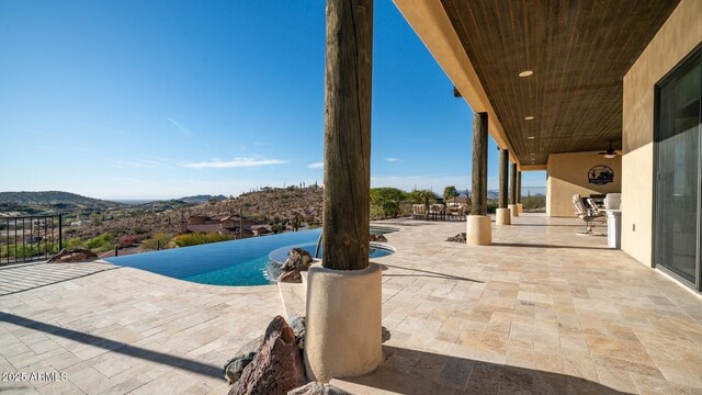 3168 S Yaqui Ln, Gold Canyon, AZ 85118 - view of pool featuring ceiling fan, a mountain view, area for grilling, and a patio area