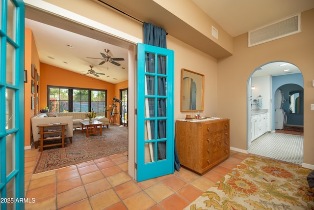 39 E Hoover Ave, Phoenix, AZ 85004 - interior space with ceiling fan, tile patterned flooring, vanity, lofted ceiling, and visible vents