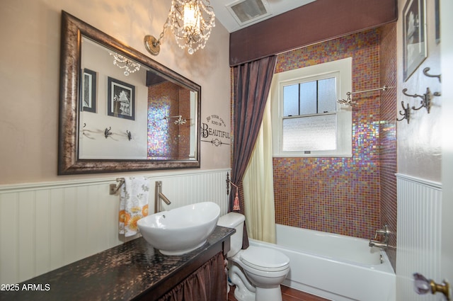 39 E Hoover Ave, Phoenix, AZ 85004 - bathroom with vanity, shower / tub combo with curtain, wainscoting, visible vents, and toilet