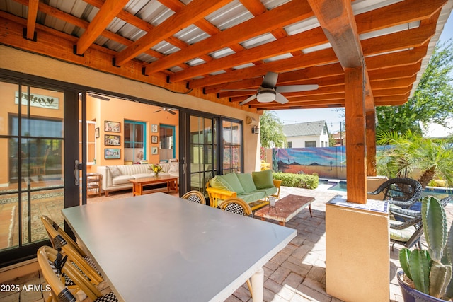 39 E Hoover Ave, Phoenix, AZ 85004 - view of patio with fence, a ceiling fan, outdoor dining space, and outdoor lounge area