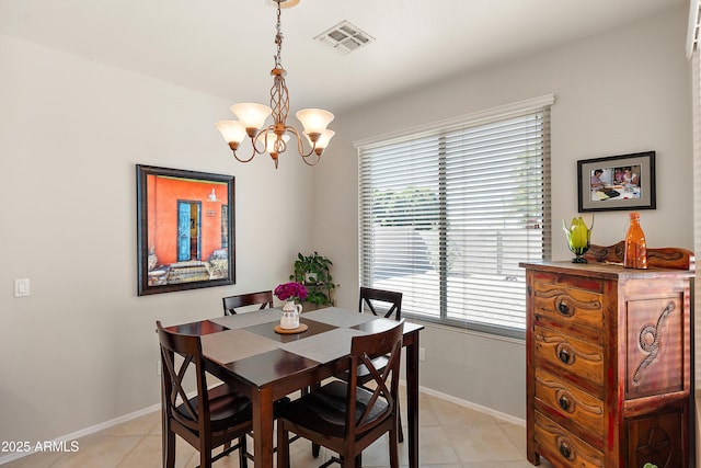 1819 W Deer Creek Rd, Phoenix, AZ 85045 - dining space featuring a chandelier, light tile patterned floors, and baseboards
