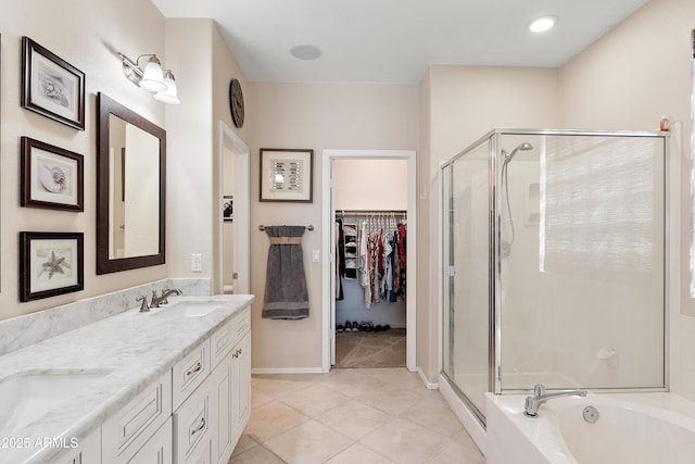 1819 W Deer Creek Rd, Phoenix, AZ 85045 - bathroom with a stall shower, double vanity, tile patterned flooring, and a spacious closet