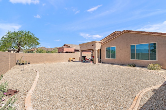 1819 W Deer Creek Rd, Phoenix, AZ 85045 - back of property with a fenced backyard and stucco siding