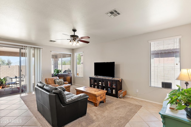1819 W Deer Creek Rd, Phoenix, AZ 85045 - living room with light tile patterned floors, ceiling fan, and baseboards