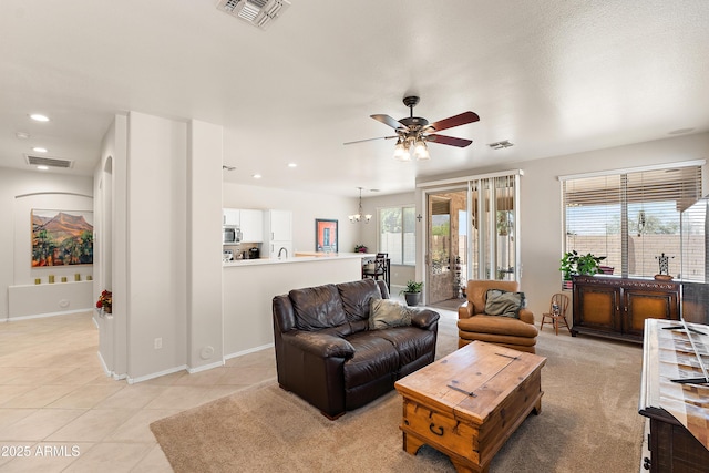 1819 W Deer Creek Rd, Phoenix, AZ 85045 - living area featuring plenty of natural light, a ceiling fan, light tile patterned flooring, recessed lighting, and baseboards