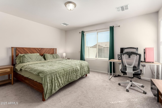 carpeted bedroom with visible vents and baseboards