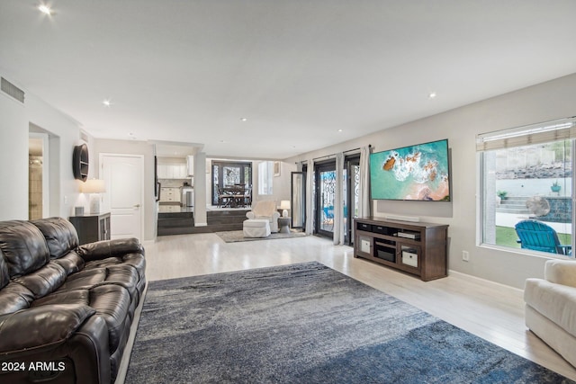 living room with light hardwood / wood-style flooring