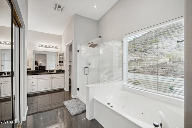 bathroom featuring vanity and plus walk in shower