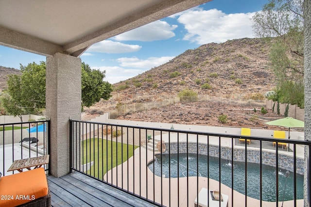 balcony with a water and mountain view