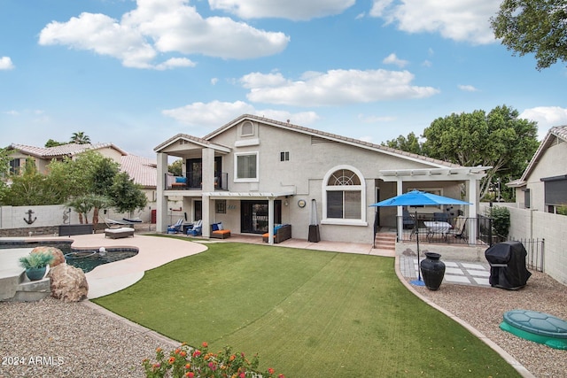 back of property featuring a lawn, a pergola, a balcony, a pool, and a patio