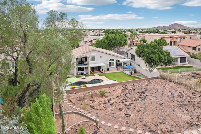 birds eye view of property featuring a mountain view