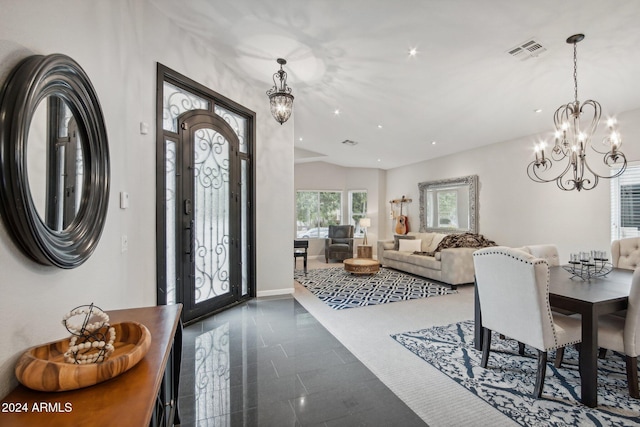 foyer entrance featuring a chandelier