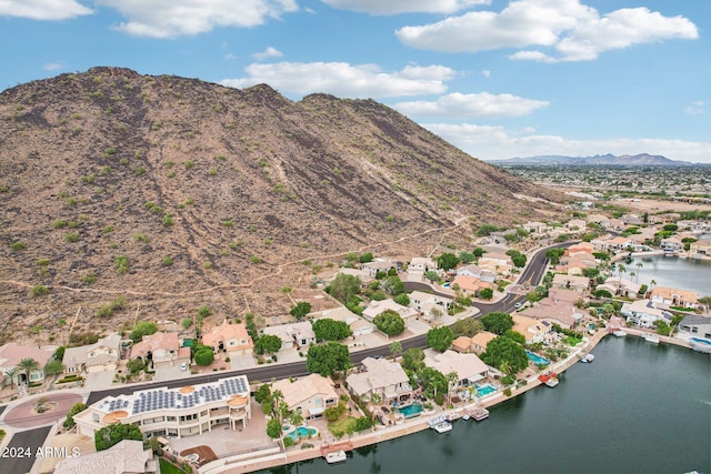 birds eye view of property featuring a water and mountain view