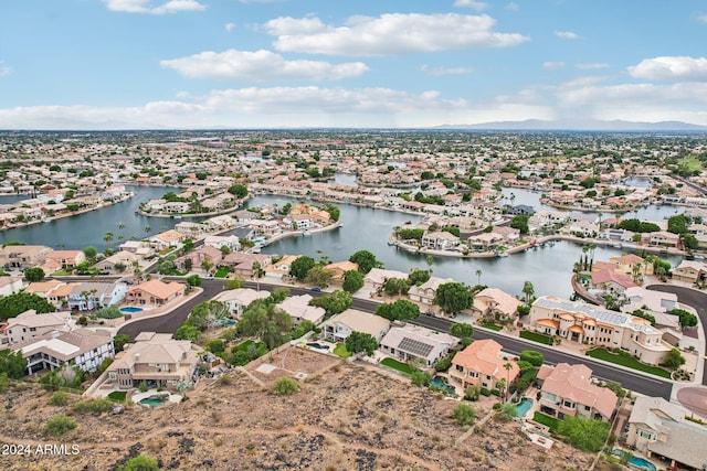 bird's eye view with a water and mountain view