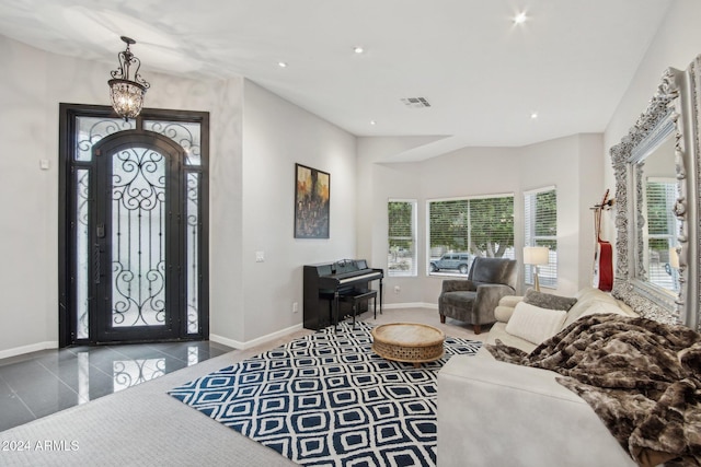 foyer featuring a chandelier