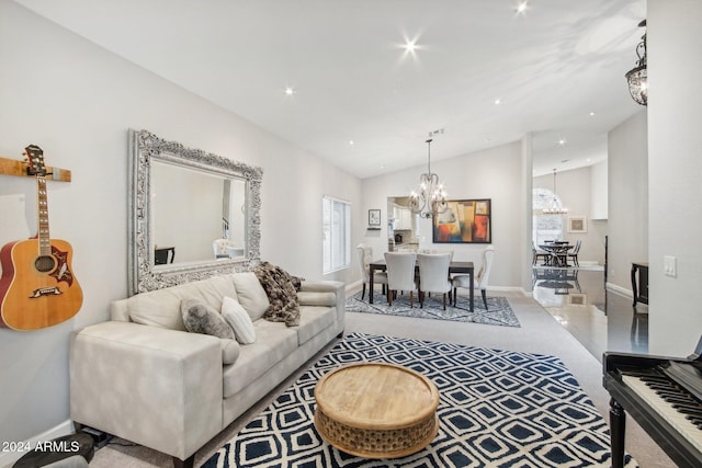 carpeted living room featuring lofted ceiling and a chandelier