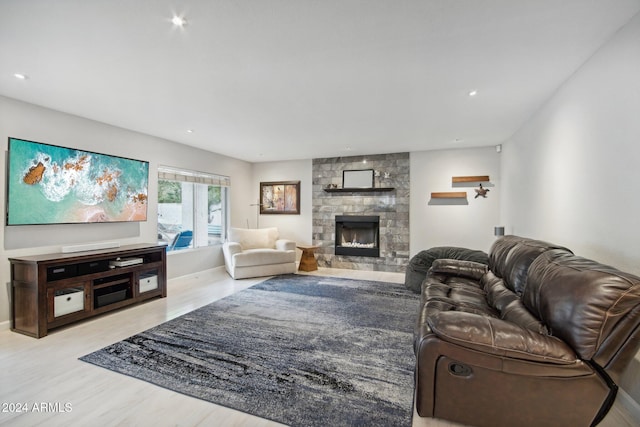 living room with a fireplace and light hardwood / wood-style floors