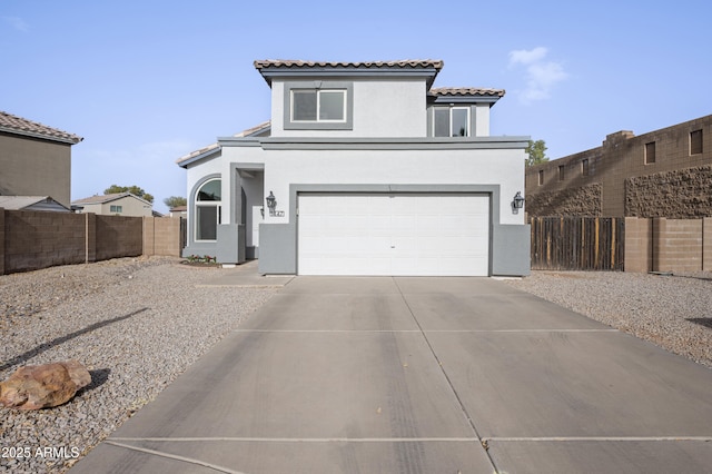 view of front of house featuring concrete driveway, fence, an attached garage, and stucco siding