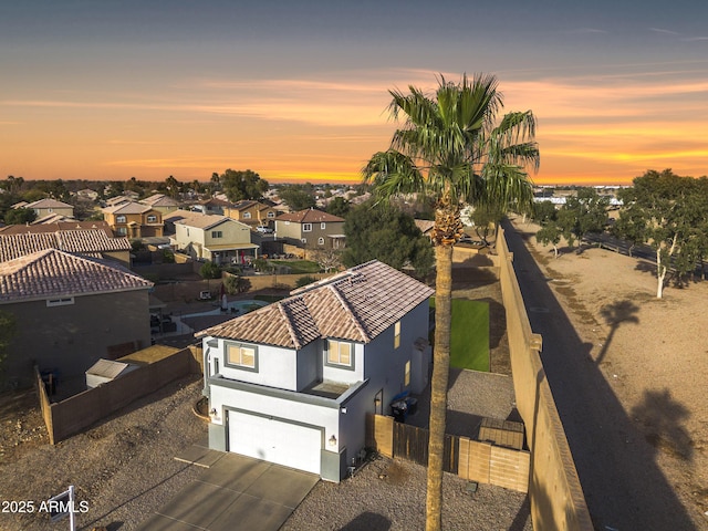 aerial view at dusk with a residential view