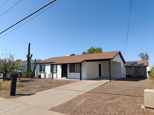 single story home with a carport