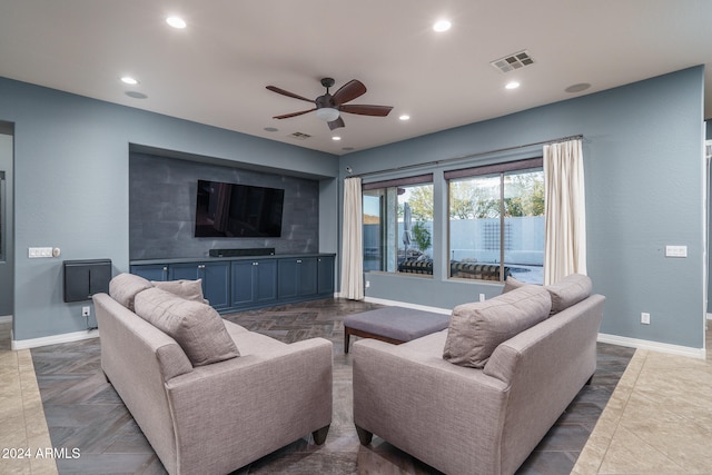 tiled living room with ceiling fan