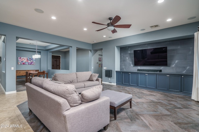 living room featuring parquet flooring and ceiling fan