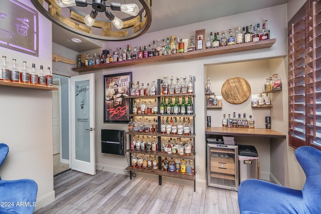 bar featuring hardwood / wood-style floors