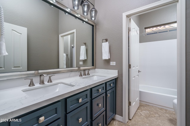 bathroom with vanity, tile patterned floors, and toilet