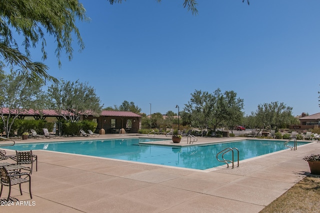 view of swimming pool featuring a patio