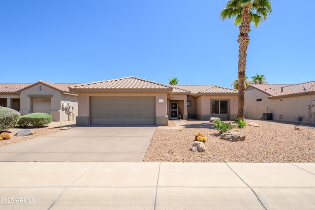 16354 W Labyrinth Ln, Surprise, AZ 85374 - view of front of home featuring stucco siding, an attached garage, concrete driveway, and a tile roof