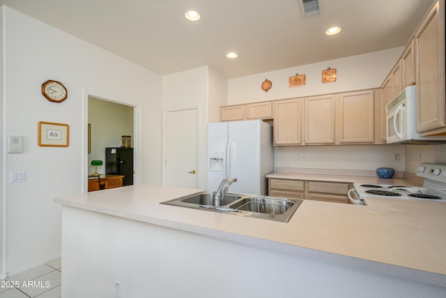 16354 W Labyrinth Ln, Surprise, AZ 85374 - kitchen featuring white appliances, light brown cabinetry, light countertops, light tile patterned flooring, and recessed lighting