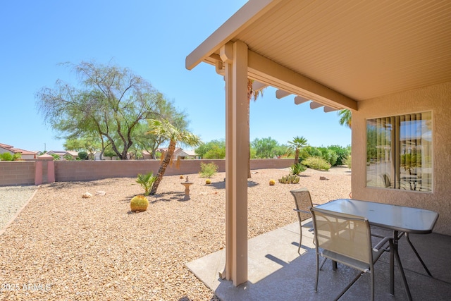16354 W Labyrinth Ln, Surprise, AZ 85374 - fenced backyard with a patio area and outdoor dining space
