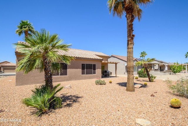 16354 W Labyrinth Ln, Surprise, AZ 85374 - rear view of property featuring stucco siding, a tile roof, and a patio