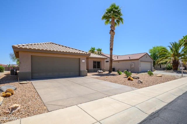 16354 W Labyrinth Ln, Surprise, AZ 85374 - view of front facade featuring a tiled roof, stucco siding, and a garage