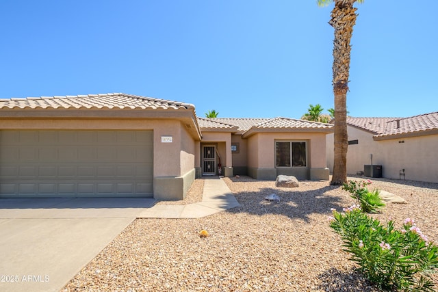 16354 W Labyrinth Ln, Surprise, AZ 85374 - view of front facade featuring an attached garage, stucco siding, a tile roof, and driveway